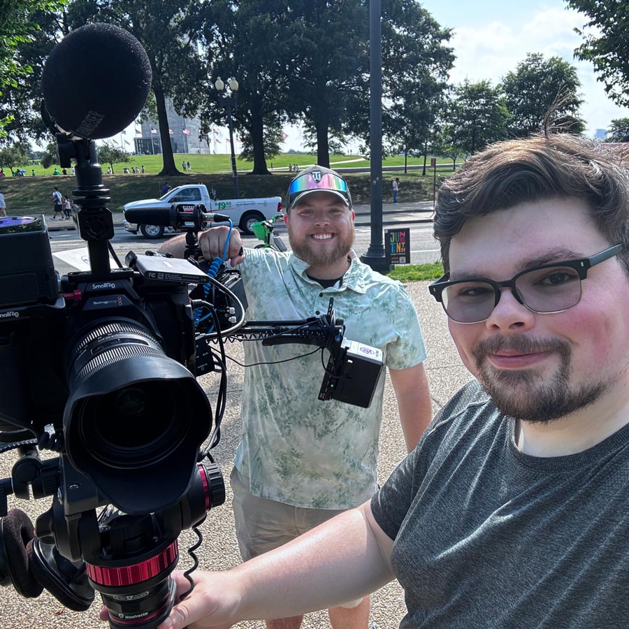 Brian and Cameron filming on the street